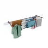 A wall-mounted drying rack with various clothes hanging on it. Voir les images du produit