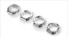 Four silver-colored watch bezels are arranged diagonally on a white background. Produktbild-Vorschau