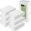 Several white cleaning sponges are stacked in front of a package of sponges. Anteprima dell’immagine prodotto