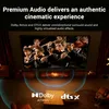 A living room scene with a TV displaying an orchestra, and sound wave graphics indicating audio features. Produktbild-Vorschau