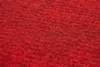 A close-up, textured view of red carpet tiles. Produktbild-Vorschau