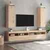 A modern living room with a wall-mounted entertainment center featuring two tall cabinets and a long media console below a TV. Voir les images du produit