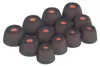 A collection of black silicone ear tips with red centers, arranged in a cluster on a white background. Náhled obrázku produktu
