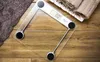A digital scale is placed on a wooden surface, with towels in the background. Náhled obrázku produktu