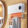 A white wall-mounted heater with a towel rack underneath, in a bathroom setting. Anteprima dell’immagine prodotto