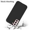 A black phone case is shown falling onto a cracked surface, implying shock absorption. Náhled obrázku produktu