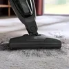 A vacuum cleaner head is shown cleaning a carpet. Voir les images du produit