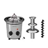 A disassembled chocolate fountain with its components laid out against a white background. Podgląd zdjęcia produktu