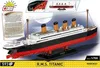 The image shows the packaging of a COBI R.M.S. Titanic building block set. The packaging features a detailed image of the assembled model ship against a backdrop of a large moon and the sea. Insets show close-ups of the model and its dimensions. Text on th Náhľad obrázku produktu