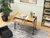 A desk with drawers and a laptop, next to a plant and a bookshelf. Produktbild-Vorschau