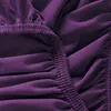 A close-up view of a purple fitted sheet, showing the elasticized edge and fabric texture. Produktbild-Vorschau