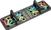 A black foldable push-up board with colored markings and handles, shown on a white background. Produktbild-Vorschau