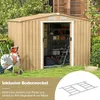 A garden shed with a hose reel in front, set on a grassy lawn with trees and a wooden structure in the background. A diagram of a base frame is shown in a circular overlay. Podgląd zdjęcia produktu
