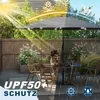 A patio umbrella is set up on a deck with outdoor furniture, illustrating its sun and rain protection features. Produktbild-Vorschau