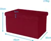 A red storage ottoman with dimensions indicated by blue arrows and text. Náhled obrázku produktu