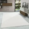 A modern living room with a large white rug in the foreground and a window overlooking a garden in the background. Anteprima dell’immagine prodotto