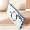 A clear, angled shot of a transparent phone case with a blue edge, featuring a magnetic ring on the back, placed on a textured surface. Produktbild-Vorschau