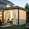 An outdoor patio area with a gazebo covered by sheer curtains, furnished with outdoor seating. Náhled obrázku produktu