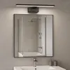 A bathroom vanity with a mirror, faucet, and soap dispenser. Produktbild-Vorschau