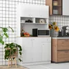 A white kitchen cabinet unit with a microwave and decorative items. Produktbild-Vorschau