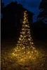 A decorative LED Christmas tree illuminated at night in front of a dark building. Produktbild-Vorschau