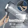 A hand holding a shower head with water spraying from it, with a close-up inset showing a finger pressing a button on the shower head. Náhľad obrázku produktu