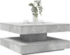 A square coffee table with a concrete-like finish, shown from a diagonal angle with two cups and a vase of greenery on top. Náhľad obrázku produktu
