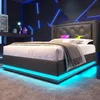 A modern bedroom with a bed featuring LED lighting. Produktbild-Vorschau