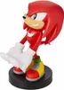 A figurine of the character Knuckles from Sonic the Hedgehog, standing on a black circular base. Podgląd zdjęcia produktu