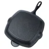 A black cast iron grill pan shown from the underside. Produktbild-Vorschau