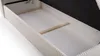 Close-up view of the interior of an open storage bed, showing the white base and wooden support. Produktbild-Vorschau