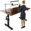 A woman is standing at a height-adjustable desk, using a computer. Produktbild-Vorschau