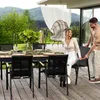 A couple is enjoying a meal on a patio with a mountain view. Produktbild-Vorschau