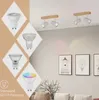 A collage of different light bulbs and ceiling lights, with a living room scene in the background. Náhľad obrázku produktu