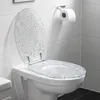 A toilet with an open, glitter-filled toilet seat in a tiled bathroom. Produktbild-Vorschau