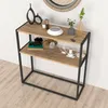 A console table with decorative items on it, placed against a white wall and on a wooden floor. Náhled obrázku produktu