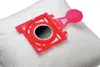 A close-up shot of a white vacuum cleaner bag with a red plastic adapter attached. Náhľad obrázku produktu