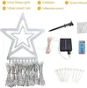 A collection of components for a star-shaped string light decoration, including the star itself, string lights, a solar panel, a remote control, and stakes. Produktbild-Vorschau