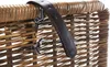 A close-up view of the top edge of a woven basket, showing a leather strap attached with knots. Podgląd zdjęcia produktu