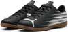 A pair of black Puma indoor soccer shoes with white accents and a brown sole. Produktbild-Vorschau