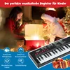 Two children are opening a gift box with a bright light emanating from it, with a toy piano in the foreground. Náhled obrázku produktu