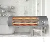 A bathroom with a bathtub, shelves with toiletries, and a wall-mounted heater. Voir les images du produit