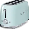 A mint green Smeg toaster is shown against a white background. Voir les images du produit