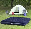 Camping scene with tent, air mattress, chairs, and backpacks Náhled obrázku produktu