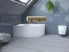 A modern bathroom with a corner bathtub, toilet, and a skylight. Produktbild-Vorschau