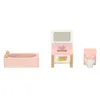 A dollhouse bathroom set including a bathtub, sink vanity, and toilet, all in pink and wood. Podgląd zdjęcia produktu