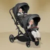 A twin stroller with two babies inside, shown against a plain background. Produktbild-Vorschau