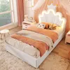 A child's bedroom with a bed, nightstand, and window. Produktbild-Vorschau