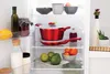 The image shows the inside of a refrigerator with various food items and cookware. Anteprima dell’immagine prodotto