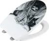 A toilet seat with a black and white image of a dog's face printed on it. Produktbild-Vorschau